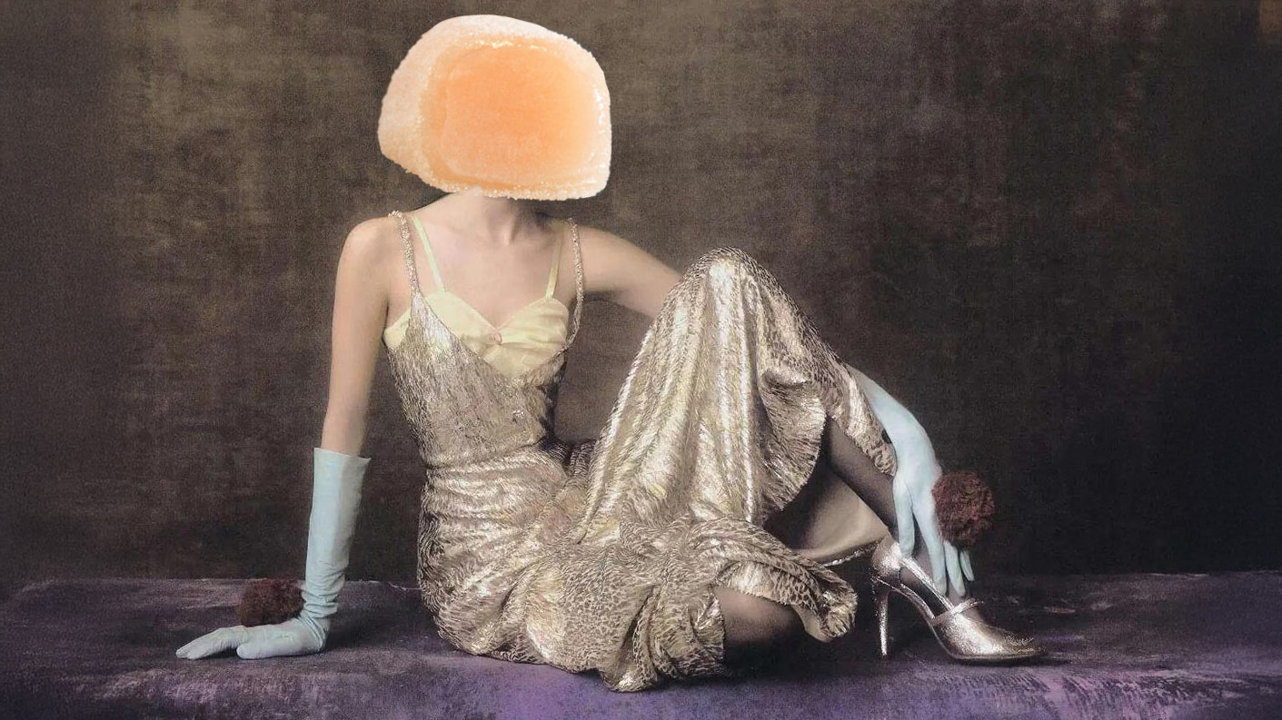 woman posing in yellow and gold dress with white gloves